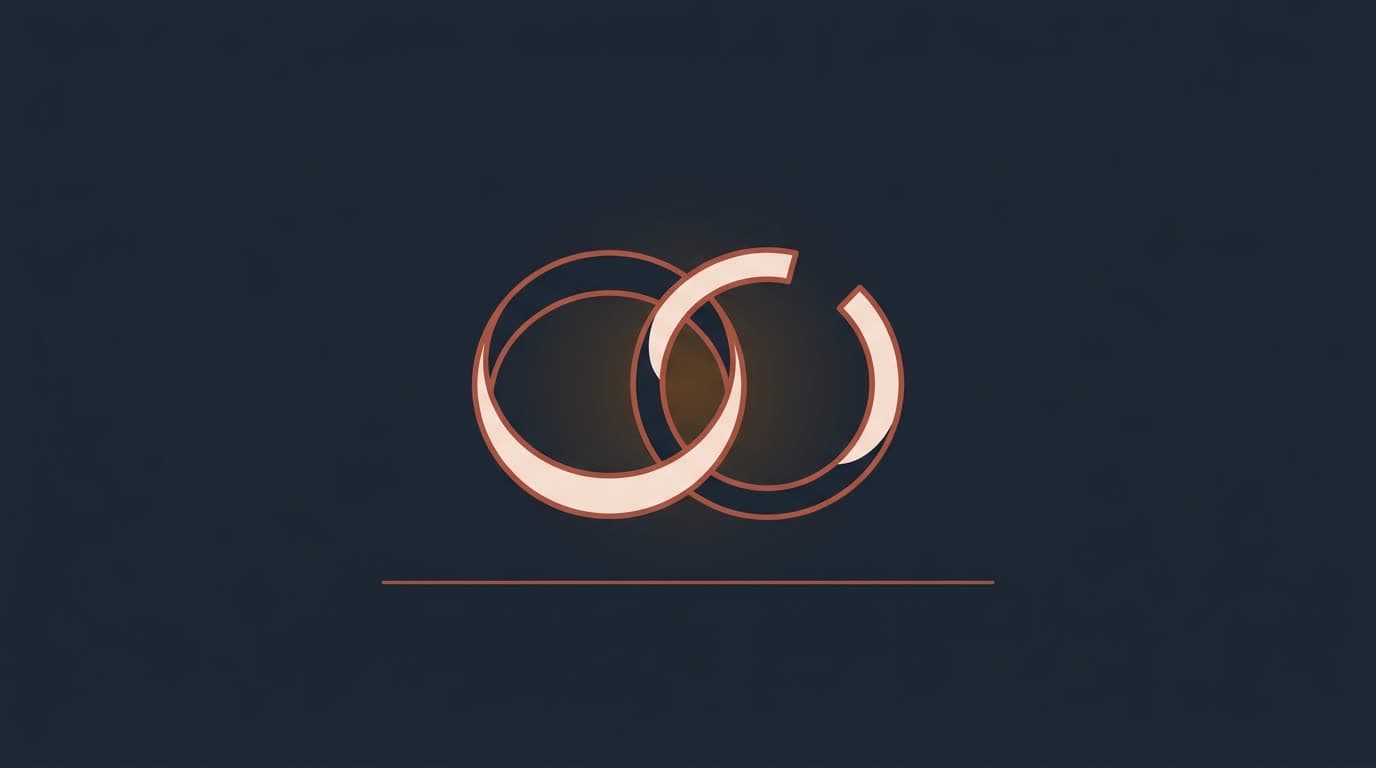 Oxblood wedding rings with one ring broken open, on a deep navy background