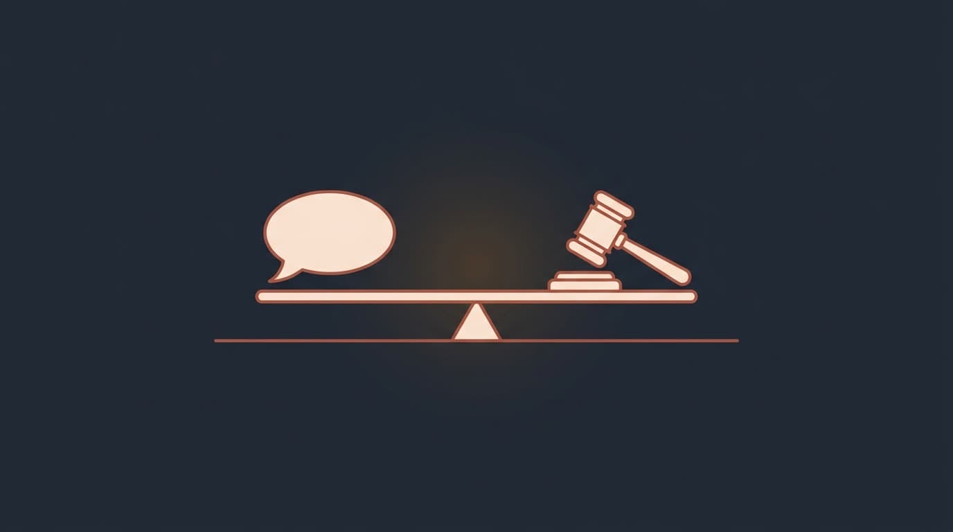 Oxblood speech bubble and gavel balanced on a beam, on a deep navy background